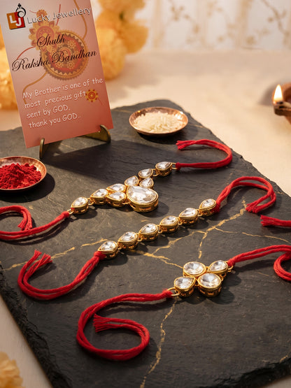 LUCKY JEWELLERY Traditional Rakhi for Brother/Bhaiya – Gold Plated Red Thread Rakshabandhan Rakhie White Stones for Bhai/Bhabhi (Pack of 3) – Fancy Rakhee Bracelet Rakshasutra (159-L1R1-04-W-3-2026)
