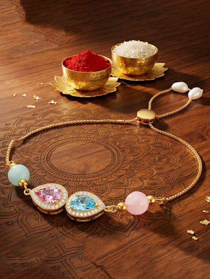 Adjustable Rakhi Bracelet with Blue & Pink drop AD Pendant,Pastel Beads,Roli Chawal & Card (209-CHB2-1279-PKF-2026)