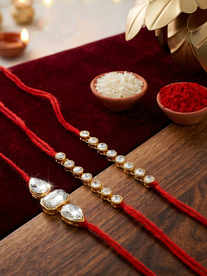 LUCKY JEWELLERY Traditional Rakhi for Brother/Bhaiya – Gold Plated Red Thread Rakshabandhan Rakhie White Stones for Bhai/Bhabhi (Pack of 3) – Fancy Rakhee Bracelet Rakshasutra (159-L1R1-08-W-3-2026)