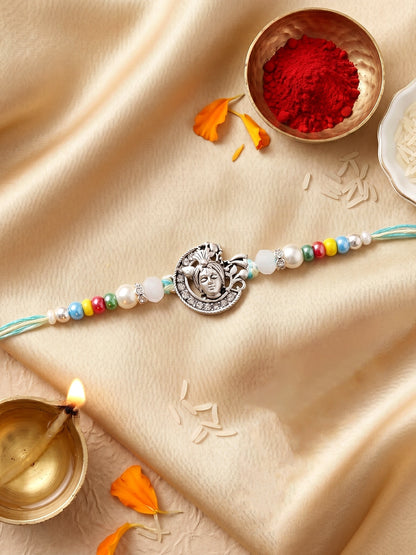 Silver-Tone Bal Gopal Krishna Rakhi for Brother | Beaded Rakhi Set With Roli Chawal & Greeting Card (102-S5R1-AR3007)