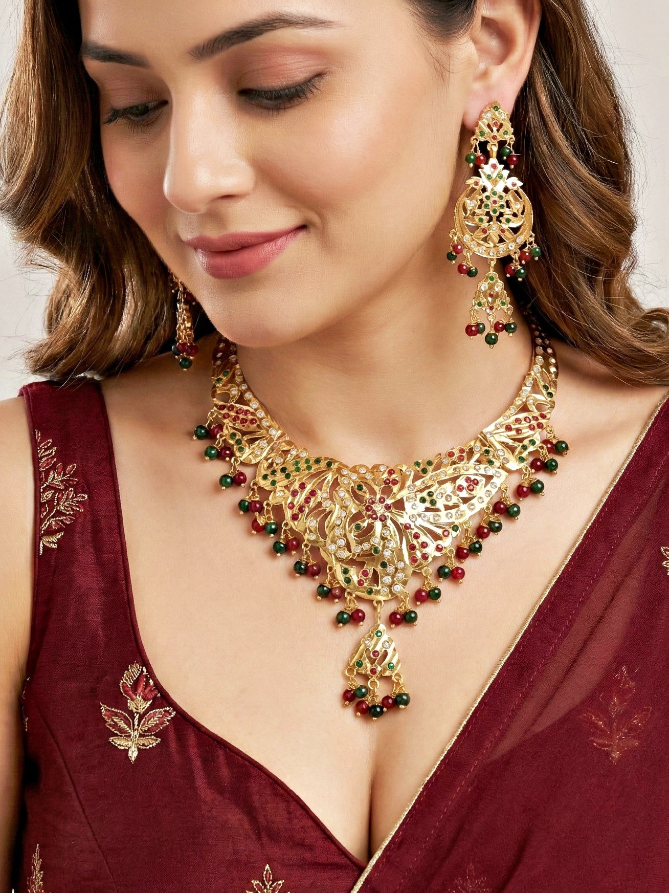 Gold Plated Navratan Bridal Jewellery Set | Traditional Red Green Stone Necklace Set with Earrings for Wedding, Engagement & Festive Wear (924-CSN-C463-RG)