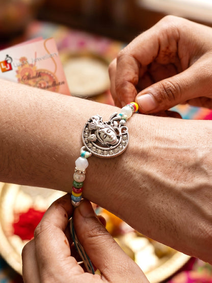 Silver-Tone Bal Gopal Krishna Rakhi for Brother | Beaded Rakhi Set With Roli Chawal & Greeting Card (102-S5R1-AR3007)