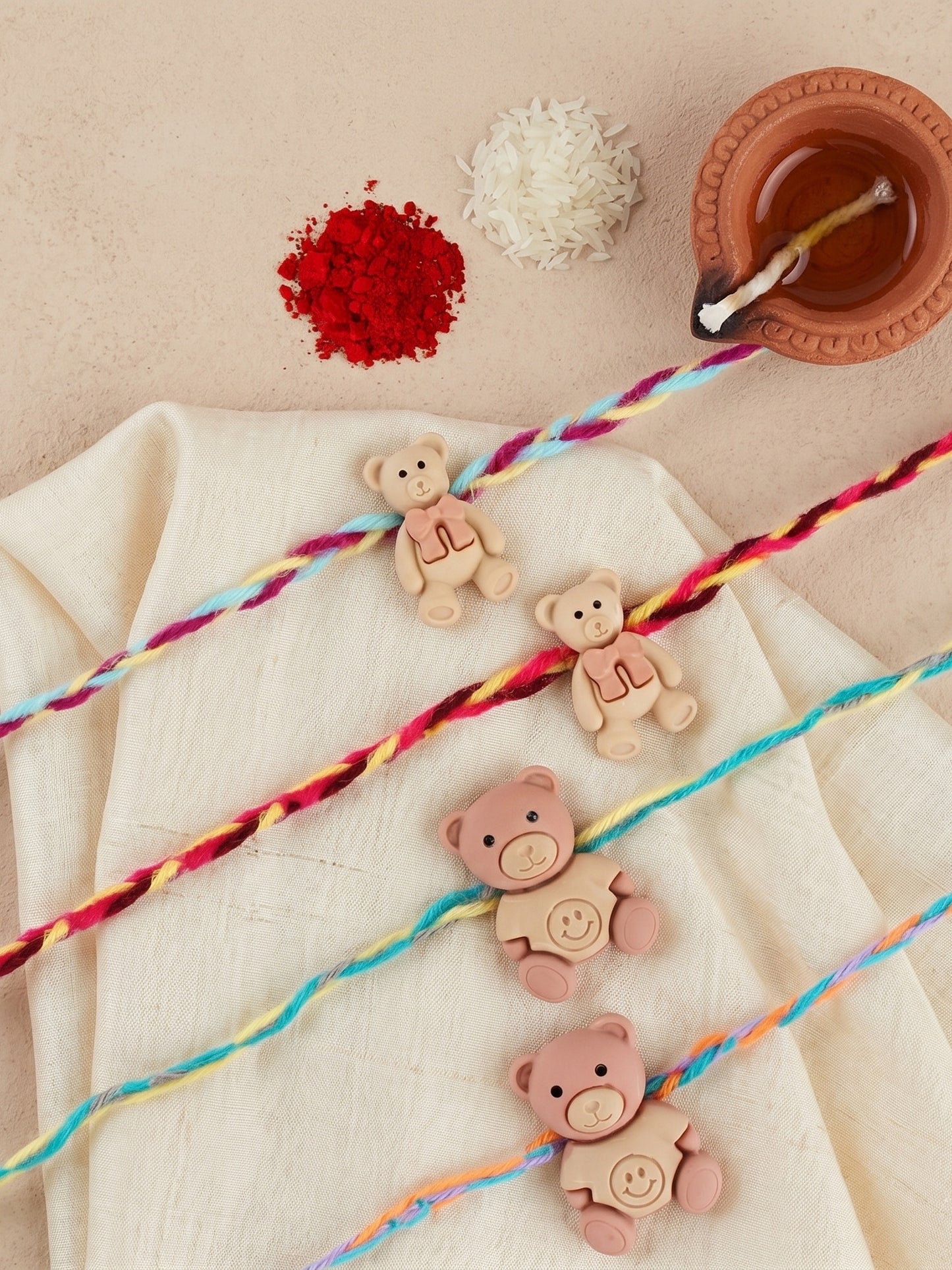 Set of 4 Small Teddy Bear Pendant Rakhi for Kids with Colorful Braided Thread, Roli Chawal & Card (130-CHR1-1948-4-2026)